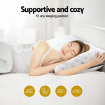 Woman sleeping comfortably on a supportive, cozy pillow with a white and gray geometric pattern