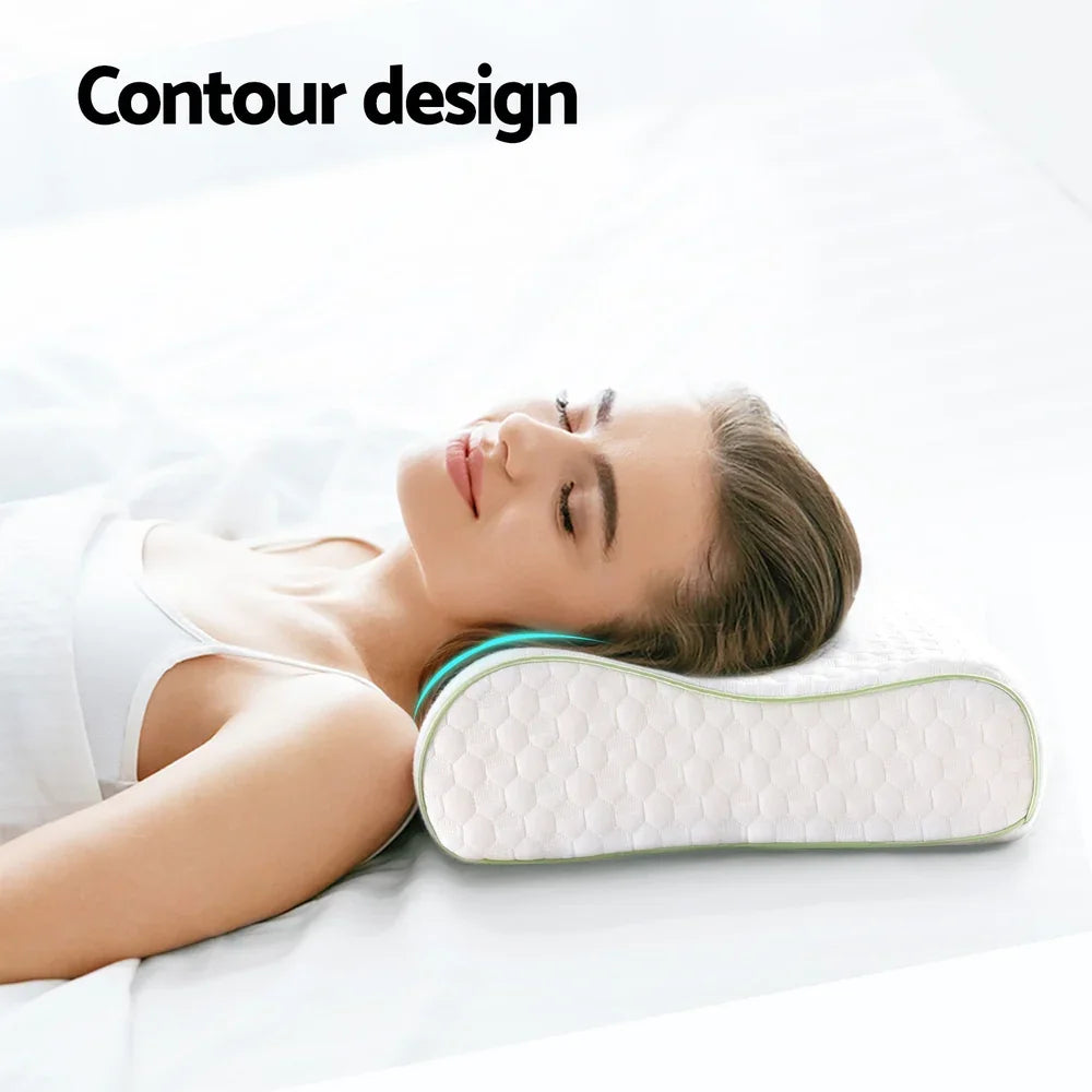 Woman lying on bed using a white ergonomic contour pillow for neck support