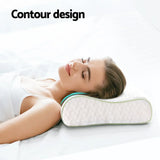 Woman lying on bed using a white ergonomic contour pillow for neck support