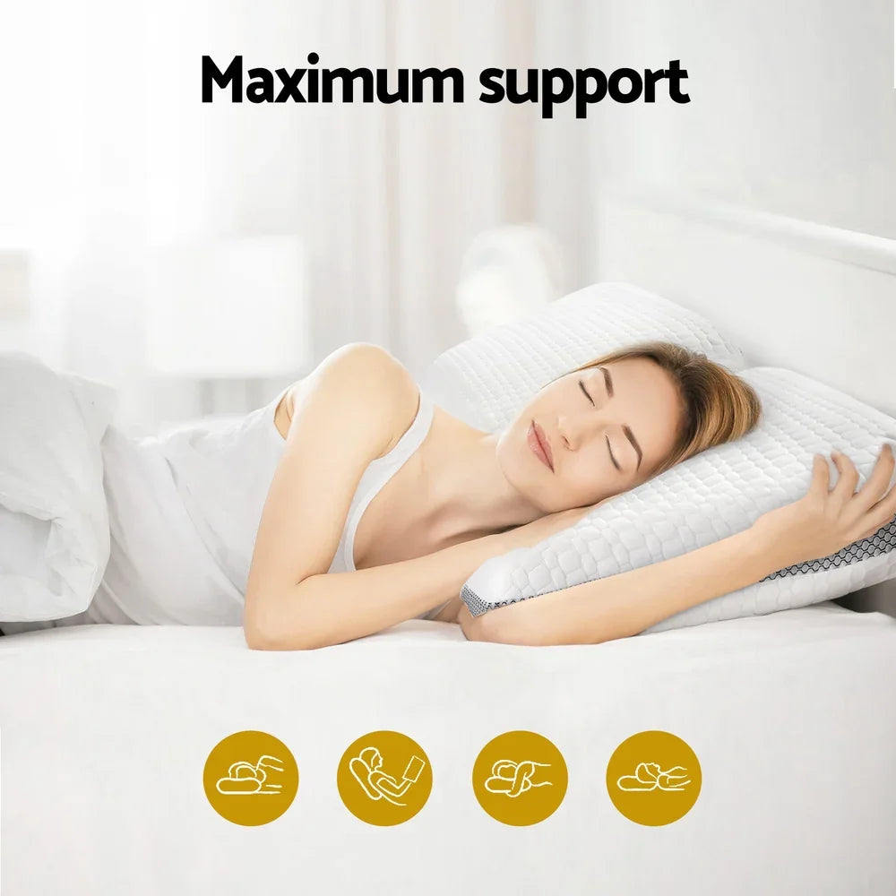 Woman sleeping peacefully on white bed using a supportive white pillow for maximum comfort
