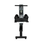 Black and silver rowing machine with digital display, foot straps, and padded seat on white background