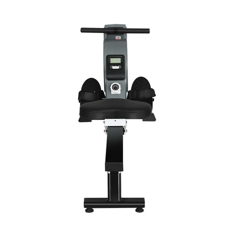 Black and silver rowing machine with digital display, foot straps, and padded seat on white background