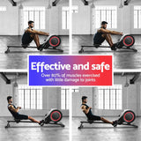 Man demonstrating rowing machine workout in a spacious gym with large windows, effective and safe fitness equipment.