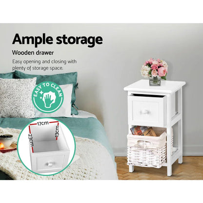 White wooden bedside table with storage drawer, basket shelf, and flower vase in bedroom