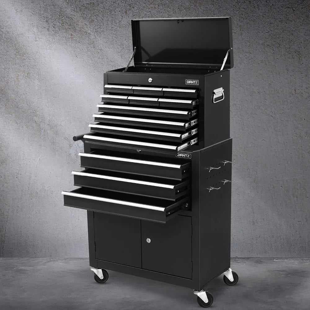 Black Griantz metal rolling tool chest with multiple open drawers and top lid on gray concrete floor