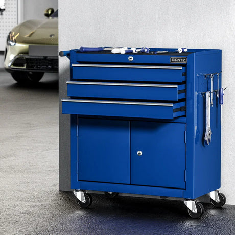 Blue GIANTZ metal tool chest with drawers, cabinet, and tools on wheels in garage