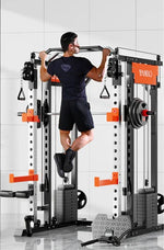 Man doing pull-ups on a multifunctional squat rack gym machine with weights.