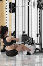 Woman using rowing machine in modern gym with power rack and mirrors