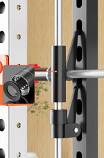 Close-up of weightlifting barbell guide rail with ball bearing detail on a power rack