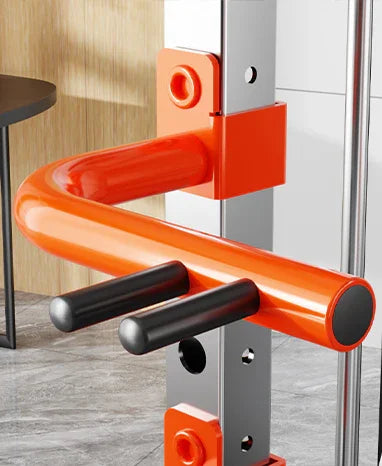 Orange gym attachment on metal power rack frame in modern fitness room