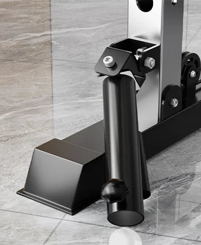 Black metal fitness equipment stand on gray marble floor, close-up view.