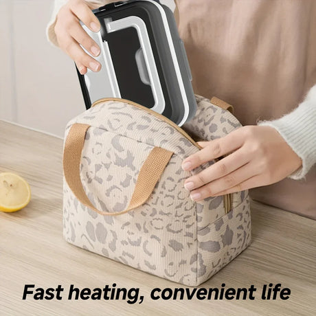Person placing a black lunchbox into a beige patterned insulated bag on a kitchen counter
