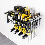 Wall-mounted black metal tool rack holding yellow power drills, tape measures, wrenches, toolboxes, and oil bottles