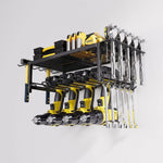 Wall-mounted black metal tool rack organizing yellow power drills, wrenches, and hand tools