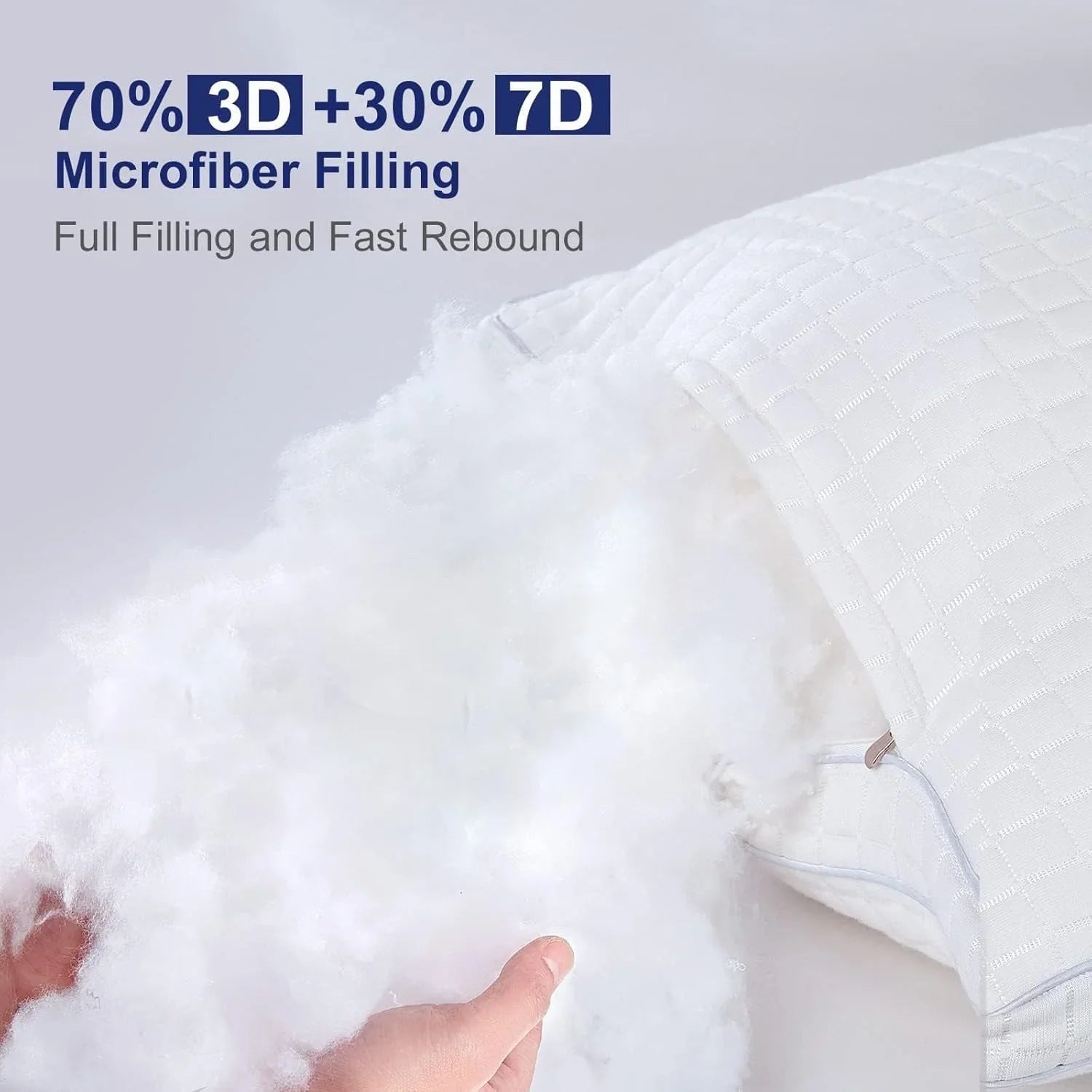 Hands holding fluffy white 3D and 7D microfiber filling from a textured white pillow with zipper