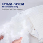 Hand holding fluffy white 3D and 7D microfiber filling from a white pillow with textured cover