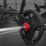46 lb black weight plate on barbell with red collar in gym setting