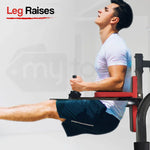 Man performing leg raises on gym equipment, core workout, athletic training, fitness exercise