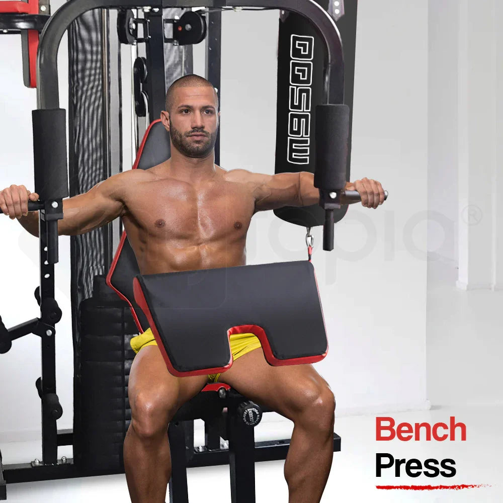 Shirtless man using home gym bench press machine for chest workout in fitness room