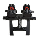 Pair of adjustable Powertrain dumbbells with weight dial on black metal stand
