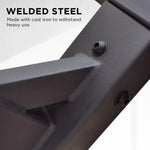 Close-up of black welded steel frame with cast iron screws, highlighting durable heavy-use construction