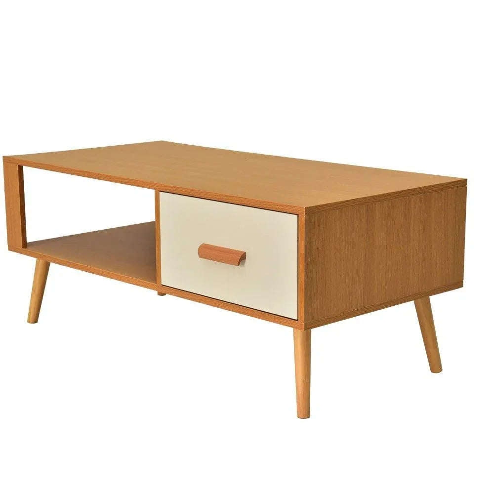 Mid-century modern wood coffee table with tapered legs, open shelf, and white drawer