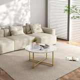 Modern living room with cream sectional sofa, marble coffee table with gold legs, and neutral decor