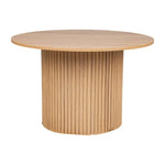 Round oak dining table with fluted wooden base and natural finish