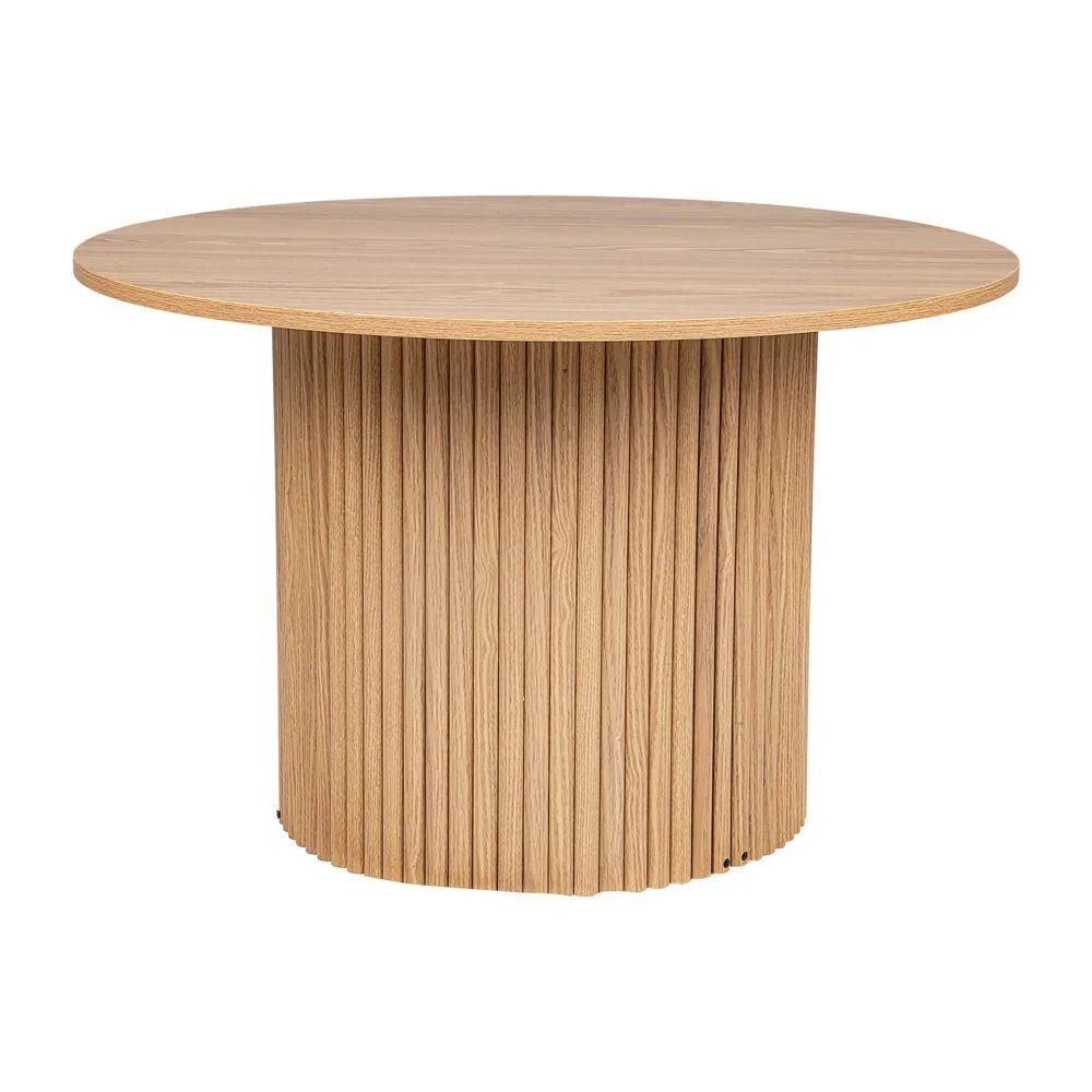Round oak dining table with fluted wooden base and natural finish