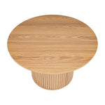 Round natural wood dining table with fluted pedestal base, modern minimalist design