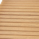 Natural wood slat wall panel with light oak finish and visible wood grain texture