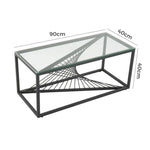 Rectangular glass coffee table with black metal frame and geometric base, 90x40x40cm