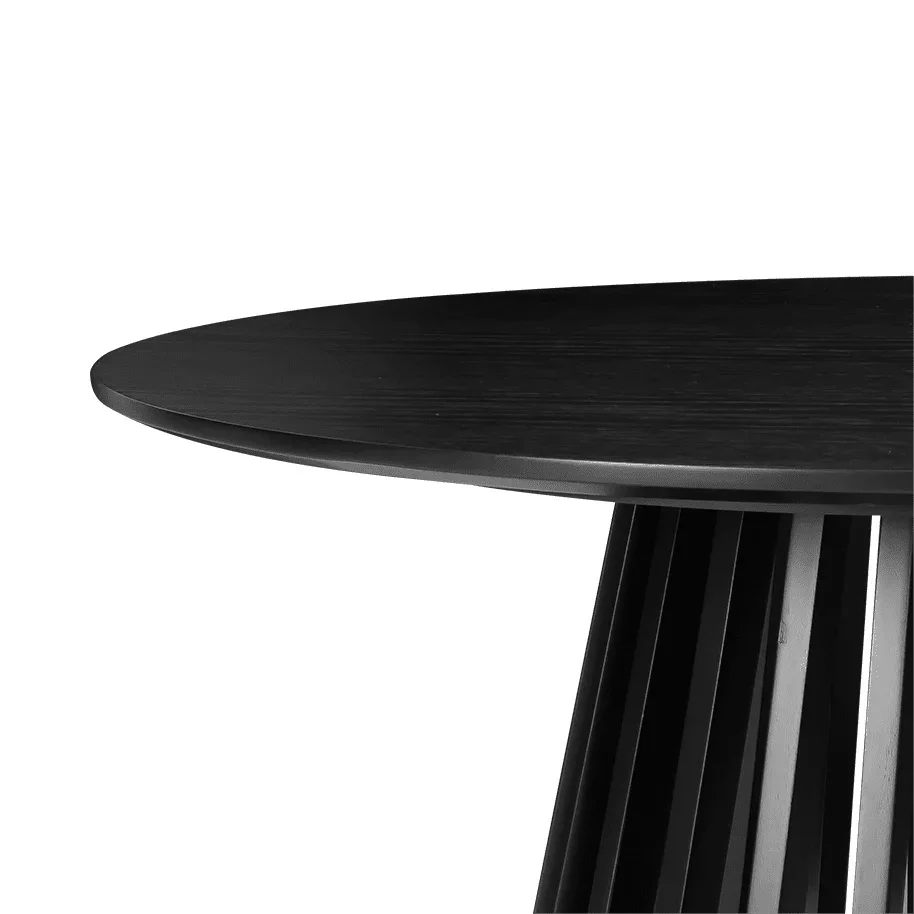 Black modern round dining table with vertical slatted pedestal base on white background