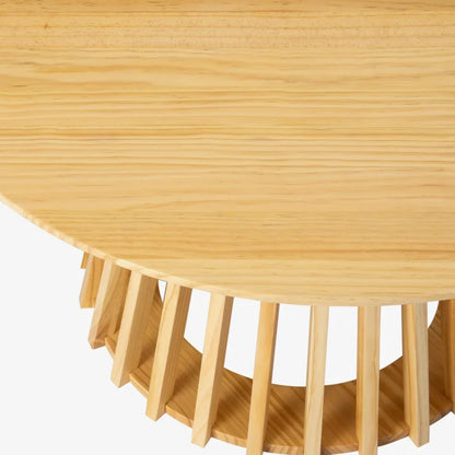 Round natural wood coffee table with slatted geometric base on a white background
