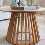 Modern wooden coffee table with slatted base in a cozy living room setting