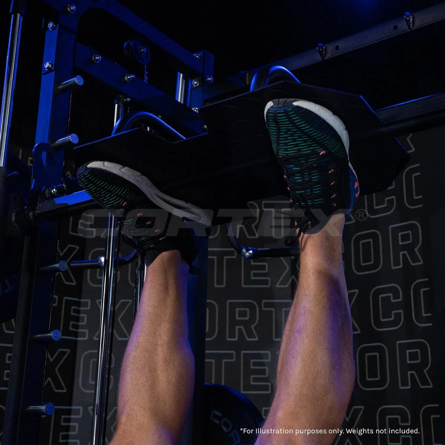 Person using Vortex leg press machine in gym, close-up on feet and equipment