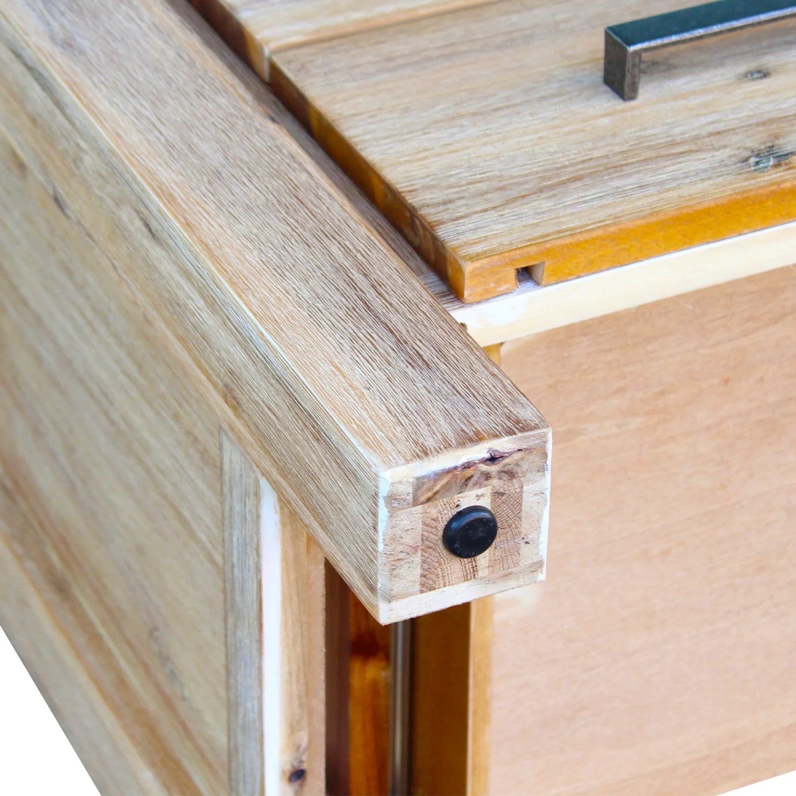 Close-up of oak wood furniture corner with visible grain and metal hardware detail