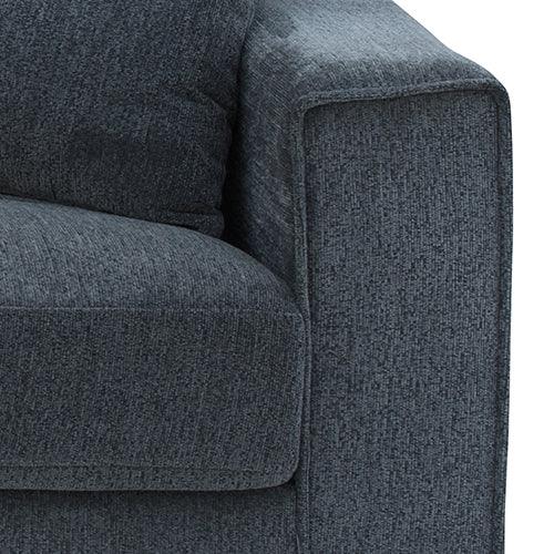 Modern dark gray fabric sofa armrest and cushion close-up