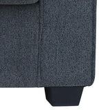 Dark gray fabric sofa corner with black tapered plastic leg, modern furniture detail