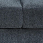Close-up of dark gray textured upholstered sofa cushions