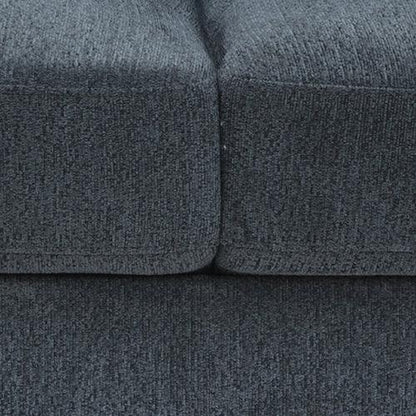 Close-up of dark gray textured upholstered sofa cushions