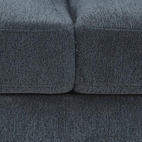Close-up of dark gray textured upholstered sofa cushions