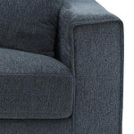 Dark blue modern fabric sofa corner with plush armrest and cushion
