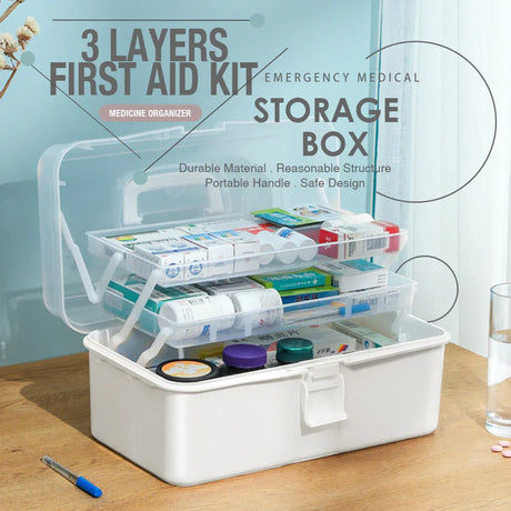 3-layer first aid kit storage box with medicine organizer on wood table, ideal for home emergency use