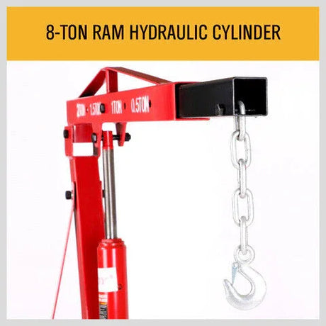 Red hydraulic ram cylinder with chain and hook for lifting, labeled 8-ton capacity