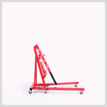 Red heavy-duty engine hoist with hydraulic lift and caster wheels on white background