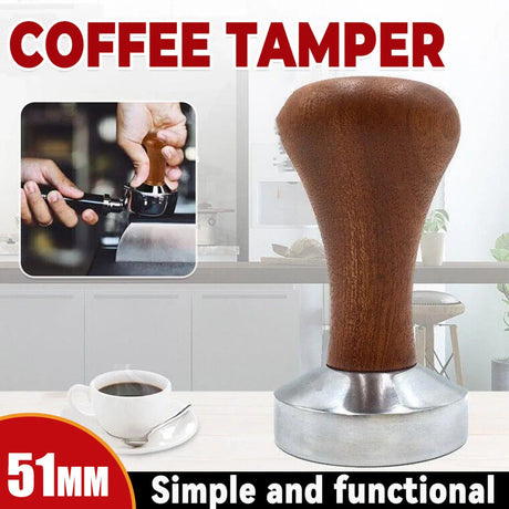 51mm coffee tamper with wooden handle and stainless steel base on kitchen counter with cup of coffee