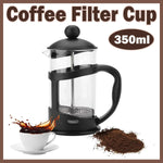 350ml black French press coffee filter cup with coffee grounds and a cup of splashing coffee