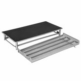 Modern grey metal coffee stand with mesh drip tray designed for espresso machines