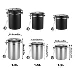 Set of black and stainless steel airtight storage jars with lids, three sizes 1.8L, 1.5L, 1.2L, each with metal measuring spoon